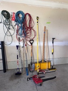 lot 10 image: Garage Utility Lot - Leaf blower, shovels, extension cords