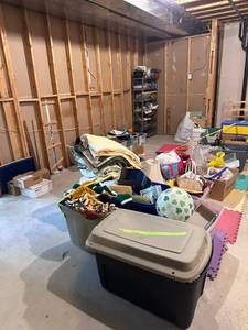 lot 34 image: Large Lot - 7 Bins of Christmas Decorations, Wrapping Paper, Gift Bags and Bows. Approximately 20 bins of Quilting items, quilt material, shelving, blankets, quilting tools ect