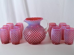 lot 1 image: Vintage Fenton Cranberry Opalescent Hobnail Pitcher and Tumblers Set