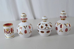 lot 9 image: Bohemian white cut to cranberry glass dresser set, 4 pieces