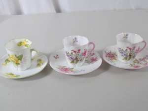 lot 44 image: Shelley England bone china floral demitasse cup and saucer trios