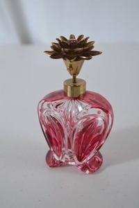 lot 51 image: Vintage Ruby Red Cut Glass Perfume Bottle with Brass Floral Stopper
