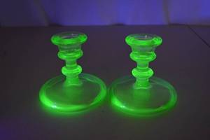lot 116 image: Pair Vintage Vaseline Glass Candlesticks Uranium Glass Glows UV