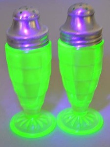 lot 124 image: Depression Glass Uranium Salt and Pepper Shakers with Metal Lids