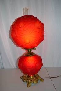 lot 171 image: Red Glass Hurricane Parlor Lamp with Floral Relief Design