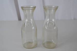 lot 218 image: Pair Vintage Glass Dairy Bottles Embossed Since 1852 Mark