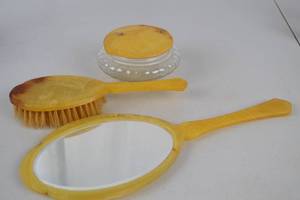 lot 259 image: Vintage Marbled Yellow Celluloid Vanity Set - Mirror, Brush, Jar