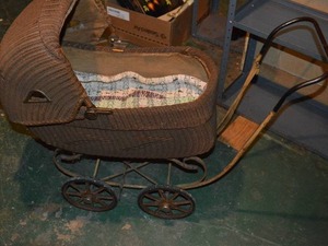 lot 300 image: Antique Wicker Baby Carriage with Iron Frame and Wheels