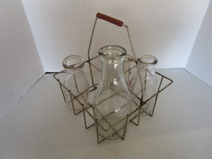lot 33 image: Wire milk bottle carrier with bottl...