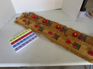 lot 118 image: Pill box, yard sticks with burlap h...
