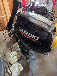 lot 162 image: Suzuki 15HP 4Stroke Tiller Handle Outboard Motor