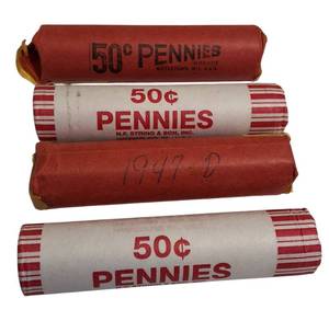 lot 58 image: Four rolls of wheat pennies from different years and have various mint markings. There are a total of 200 coins.