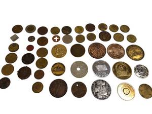 lot 69 image: A bag of assorted tokens from various locations. Its very cool to look through