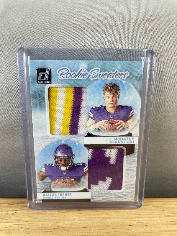 lot 46 image: 2024 Panini Donruss JJ McCarthy, Dallas Turner Rookie Sweaters #RHD-MIN T