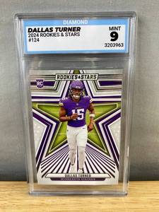 lot 414 image: Dallas Turner 2024 Rookies & Stars Minnesota Vikings NFL Rookie Card - Diamond Graded Mint 9