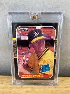 lot 415 image: 1987 Donruss MLB Oakland As Mark McGwire Rated Rookie Baseball Card