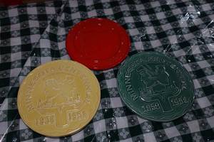 lot 103 image: 2 Red Wing Pottery Minnesota Centennial Trivets and Frankoma Trivet