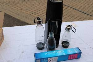 lot 28 image: Sodastream Machine, Inc Bottles and CO container