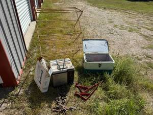 lot 93 image: Cooler with Toys, Drying Rack, Turkey Fryer & Roof Jacks