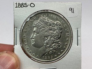 lot 91 image: 1885-O Morgan Silver Dollar