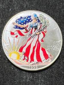 lot 39 image: 1999 AMERICAN SILVER EAGLE 1 TROY OZ .999 FINE SILVER IN COLOR