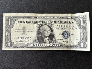 lot 4 image: 1957 Blue Seal $1 Dollar Silver Certificate Star Note