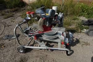 lot 241 image: Bosch 12 Dual-Bevel Hinge Slide Miter Saw on Rolling Stand