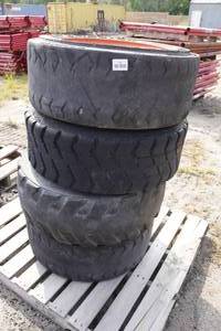 lot 164 image: Skid Steer Wheels and Tires