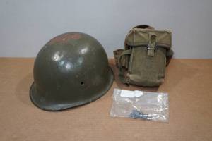 lot 13 image: Vintage Vietnam Steel Helmet with Hole and Ammo Belt