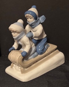 lot 70 image: Children on a Sled Porcelain Figurine by Paul Sebastian