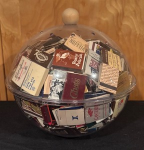 lot 162 image: Collection of Vintage Matchbooks in Clear Globe Container