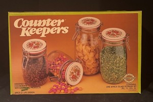 lot 241 image: Sealed Corning Ware Spice of Life 4-Piece Glass Counter Keepers Canister Set