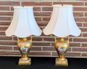 lot 54 image: LR - Pair of 21-Inch Gilded Porcelain Table Lamps with Classical Scenes