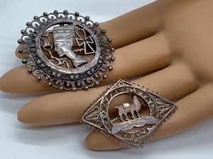 lot 32J image: Set of 2 Vintage Metal Filigree Brooches with Egyptian and Llama Motifs