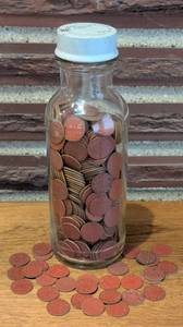 lot 185A image: Bottle Full of WWII Red Point Ration Tokens