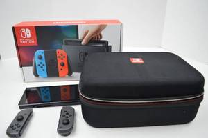 lot 51 image: Nintendo Switch Console with Gray Joy-Con Controllers, Case, and Accessories