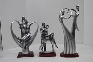 lot 117 image: Set of three modern romantic silver-tone resin sculptures