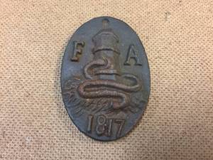 lot 142 image: Vintage Cast Iron Firemans Association - FA 1817