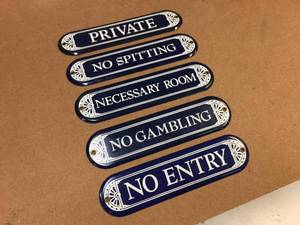 lot 174 image: Set of 5 Ande Rooney - Enameled Signs - 10 x 2 12