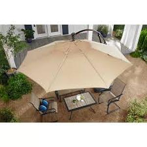 lot 42 image: Hampton Bay 11 ft. Aluminum Cantilever Solar LED Offset Patio Umbrella in Putty Beige Customer Returns See Pictures