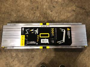 lot 60 image: Gorilla Ladders 4 ft. x 12 in. x 20 in. Aluminum Slim-Fold Work Platform, 300 lbs. Load Capacity   Customer Returns See Pictures