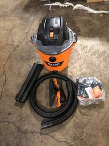 lot 27 image: RIDGID 12 Gal. 5.0 Peak HP NXT Shop Vacuum Wet Dry Vac with General Debris Filter, Locking Hose and Attachments HD1200  Customer Returns See Pictures