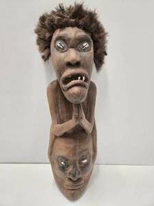 lot 26 image: Large Grotesque Figural Carved New Guinea Mask