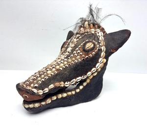 lot 9 image: Exceptional Melanesian Overmodeled Boar Skull