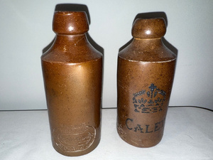 lot 84 image: Pair of Vintage English Ironstone Stoneware Bottles with Embossed Branding