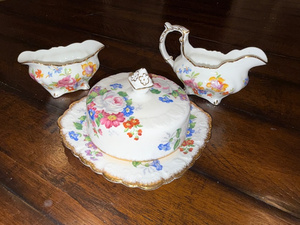 lot 174 image: Porcelain Floral Creamer, Sugar Bowl, and Butter Dish Set