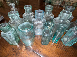 lot 223 image: Lot of Antique English Embossed Apothecary Glass Bottles