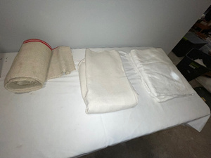 lot 249 image: Lot of Assorted French Linens with Red Stripe Roll and White Sheets