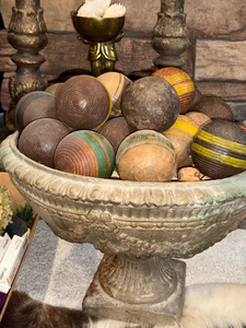 lot 134 image: Vintage Bocce Balls in Ornate Planter