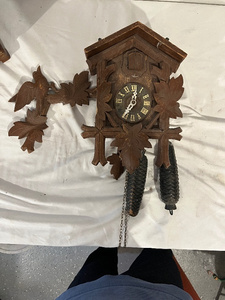 lot 108 image: Vintage German-Made Cuckoo Clock with Carved Bird & Leaf Design